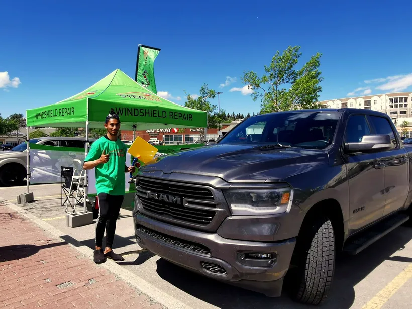 Repairs of a pickup truck complete at a Stealth Windshield Repair tent