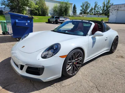 A beautiful white Porsche Cayman after a windshield replacement at Stealth Windshield Repairs