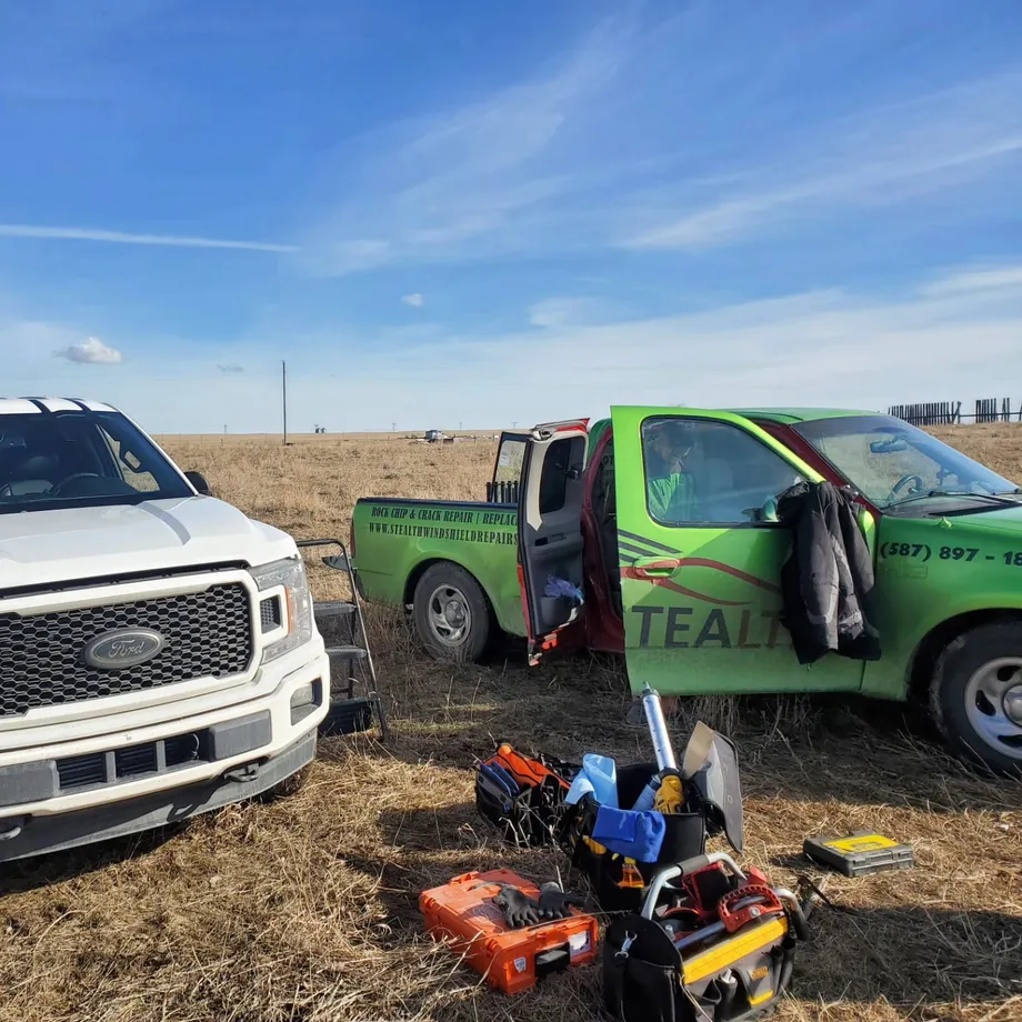 A Stealth technician is on a mobile windshield repair job in calgary