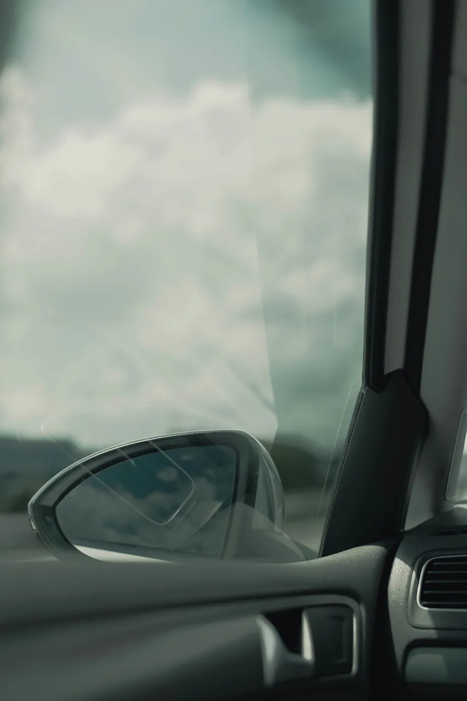 Looking outside through a clear side windshield of a car
