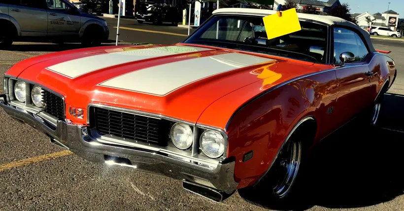 1969 Oldsmobile 442 Convertible, an iconic muscle car, at a Stealth tent having just undergone windshield chip repair